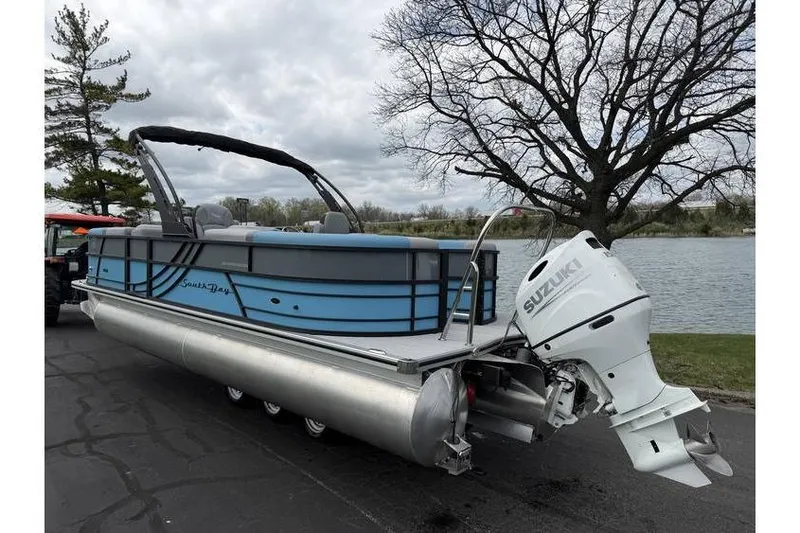Slide: The Image of 2026 South Bay 224 RS 3.0 Hybrid Arch pontoon boat with Suzuki outboard motor. - 3