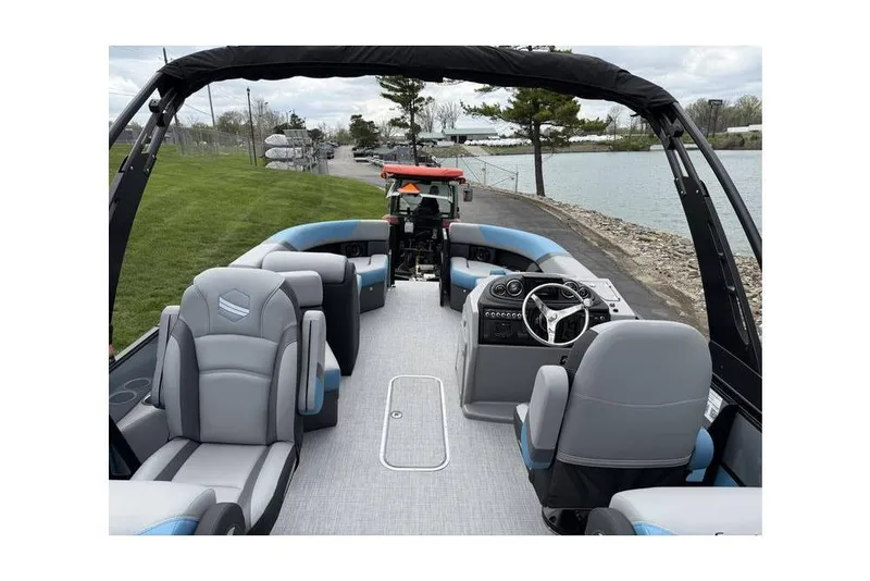 Slide: The Image of 2026 South Bay 224 RS 3.0 Hybrid Arch boat interior with modern seating and steering. - 8