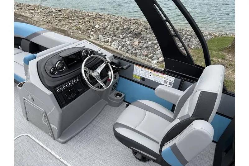 Slide: The Image of Interior of 2026 South Bay 224 RS 3.0 Hybrid Arch boat with modern helm and seating. - 9