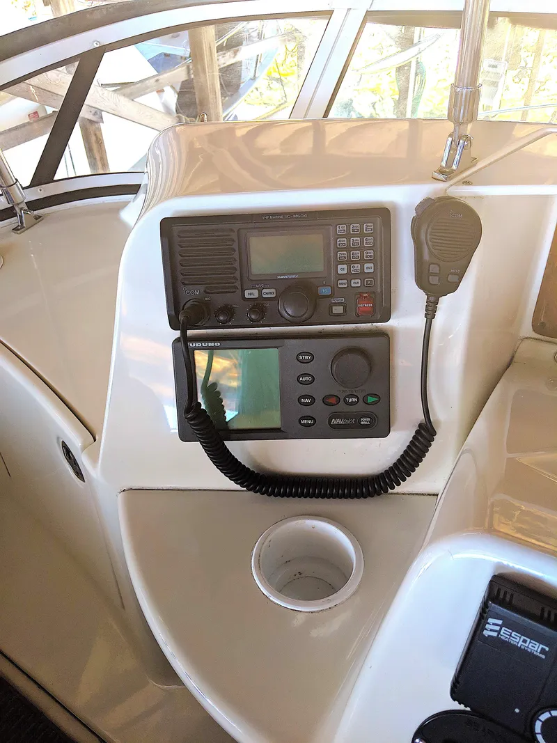 Slide: The Image of Silverton 39 Motor Yacht 2005 helm with radio equipment. - 12