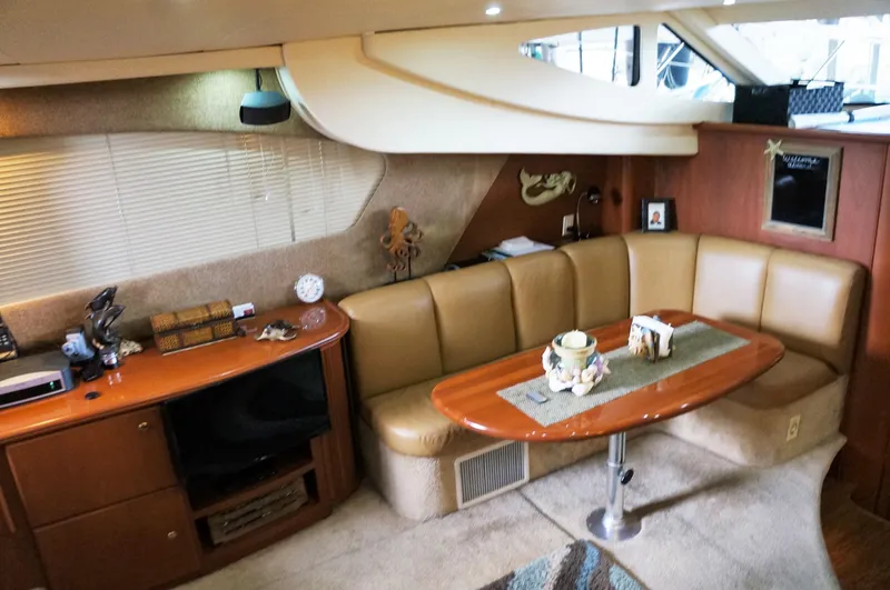 Slide: The Image of Interior of 2005 Silverton 39 Motor Yacht with cozy seating area. - 16