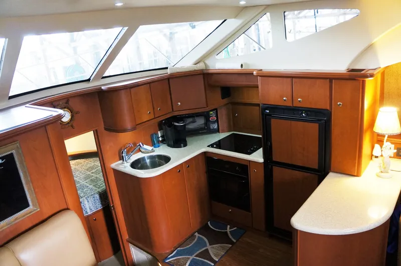 Slide: The Image of Interior of 2005 Silverton 39 Motor Yacht featuring modern kitchen. - 19