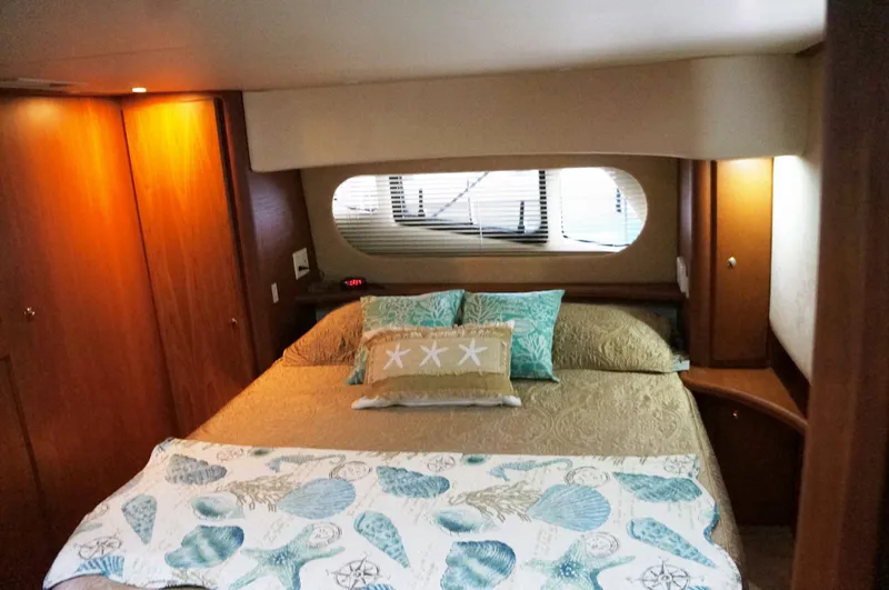 Slide: The Image of Interior of 2005 Silverton 39 Motor Yacht, cozy bedroom with window. - 22