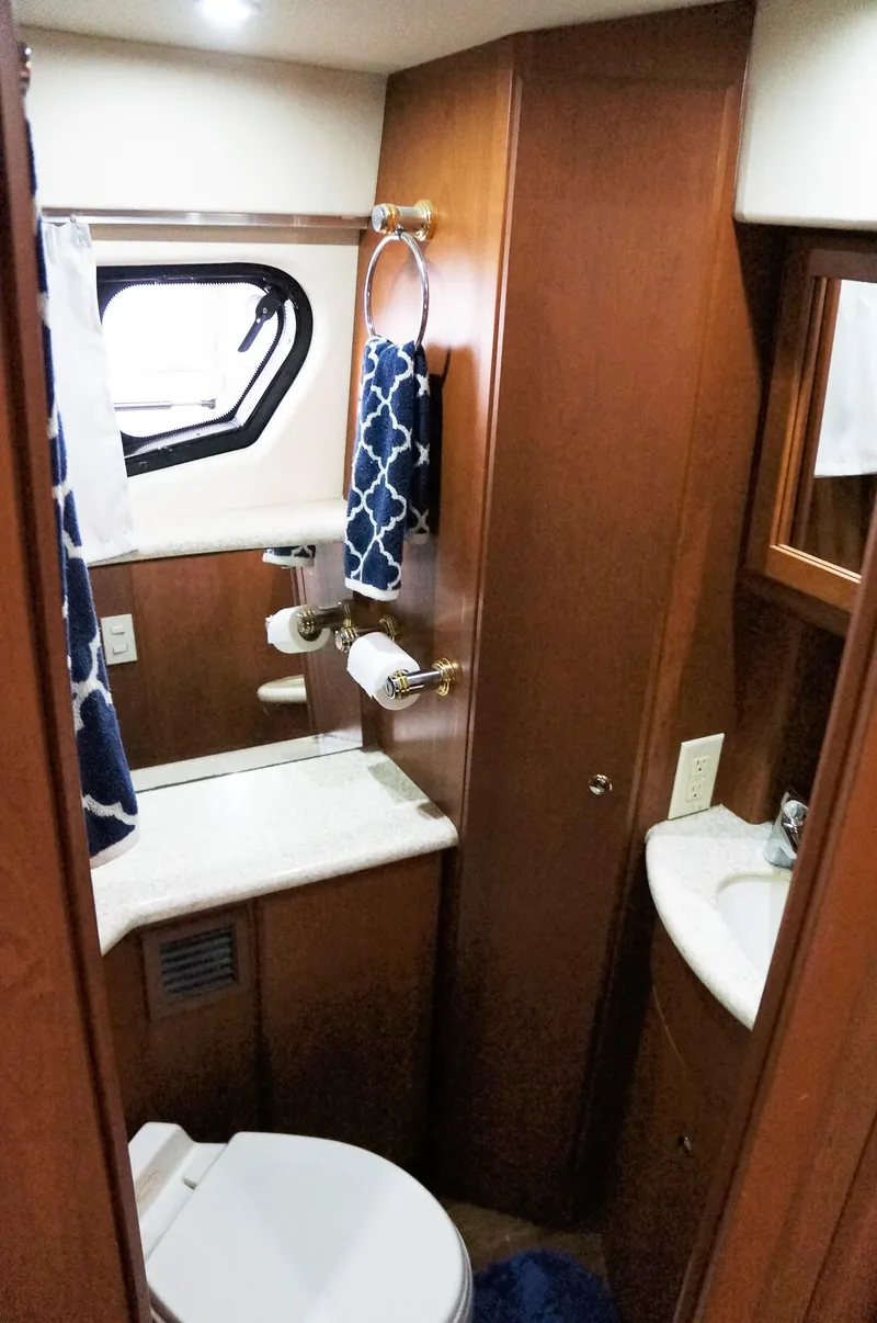 Slide: The Image of 2005 Silverton 39 Motor Yacht bathroom with wood paneling. - 24