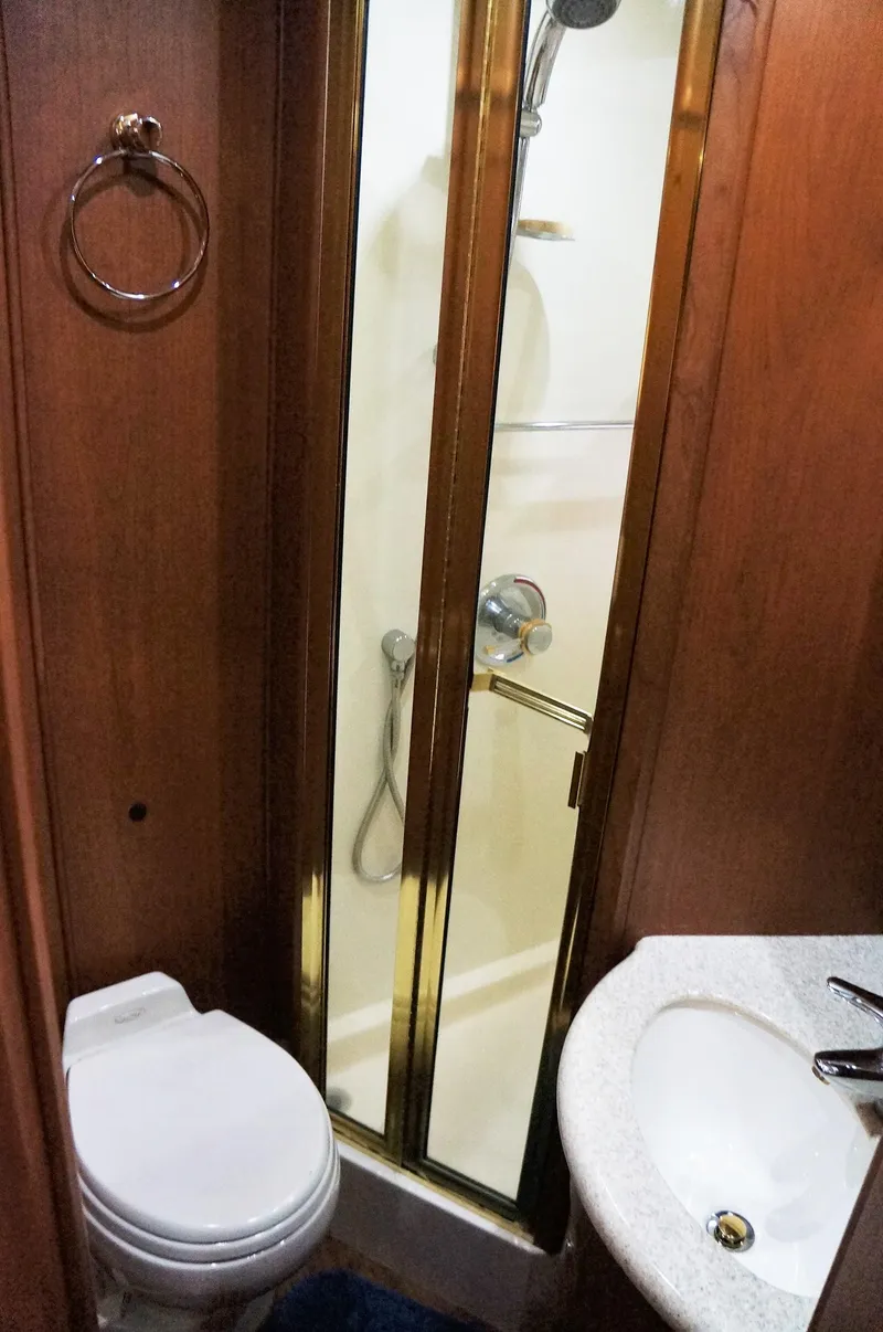 Slide: The Image of Bathroom of 2005 Silverton 39 Motor Yacht with shower and toilet. - 27