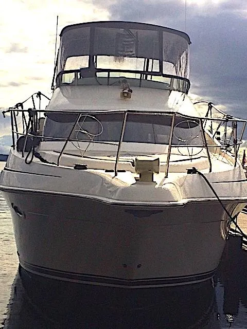 Slide: The Image of 2005 Silverton 39 Motor Yacht docked at sunset. - 4