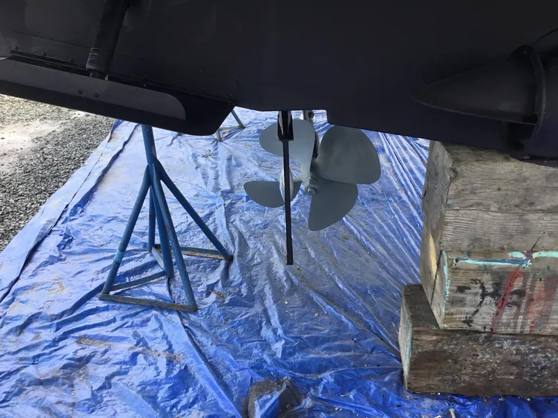 Slide: The Image of Propeller of a 2005 Silverton 39 Motor Yacht on blue tarp. - 41