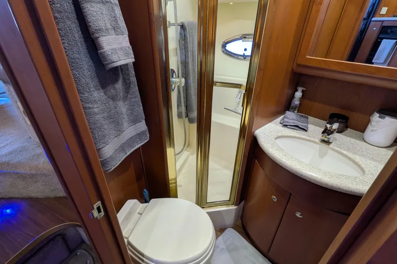 Slide: The Image of Bathroom interior of 2005 Silverton 39 Motor Yacht with shower, sink, and toilet. - 50