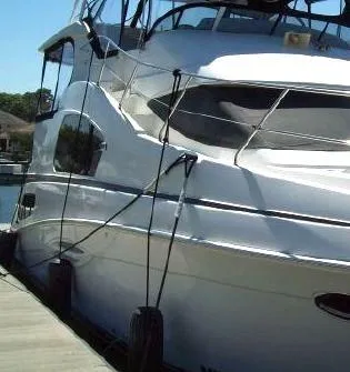 Slide: The Image of 2005 Silverton 39 Motor Yacht docked at marina. - 5