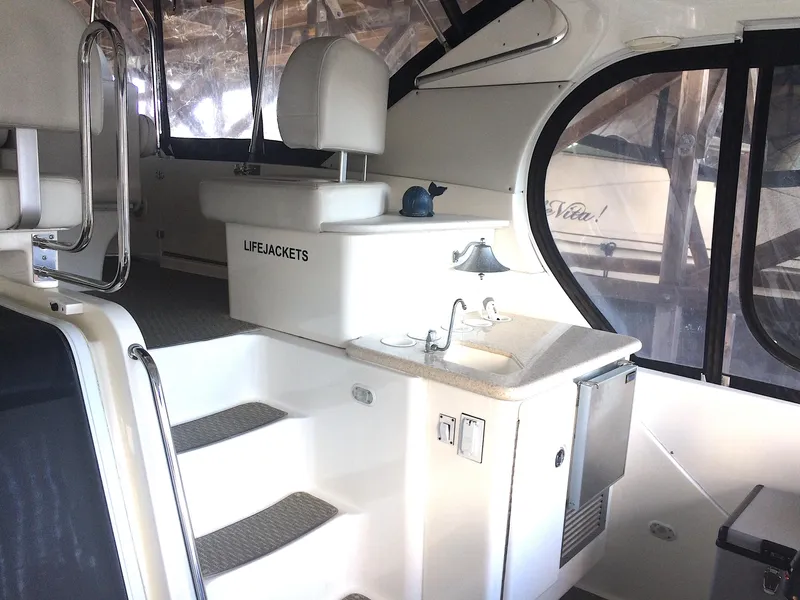 Slide: The Image of Interior of 2005 Silverton 39 Motor Yacht with sink and seating area. - 7
