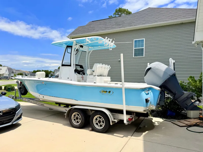 The Image of 2019 Sea Hunt BX 25 FS boat on trailer in driveway. - 0