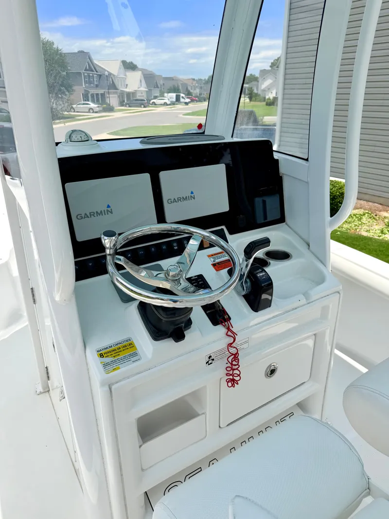 Slide: The Image of 2019 Sea Hunt BX 25 FS boat console with Garmin displays. - 11