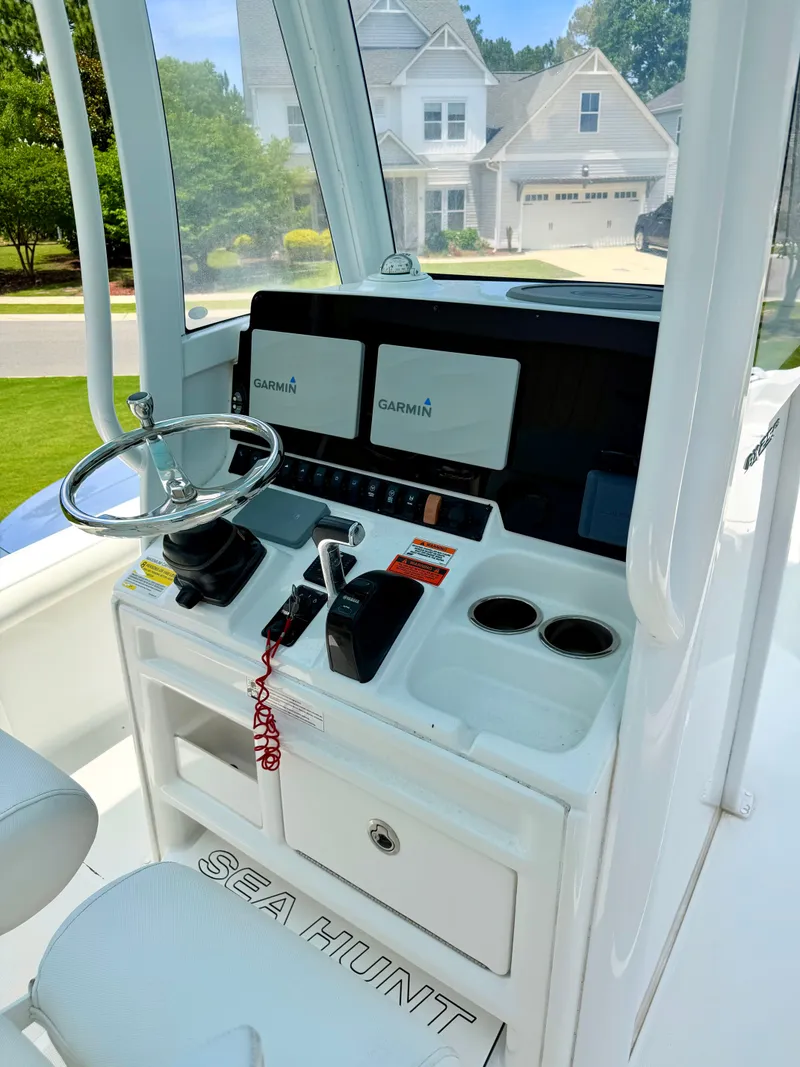 Slide: The Image of 2019 Sea Hunt BX 25 FS boat console with Garmin displays. - 13