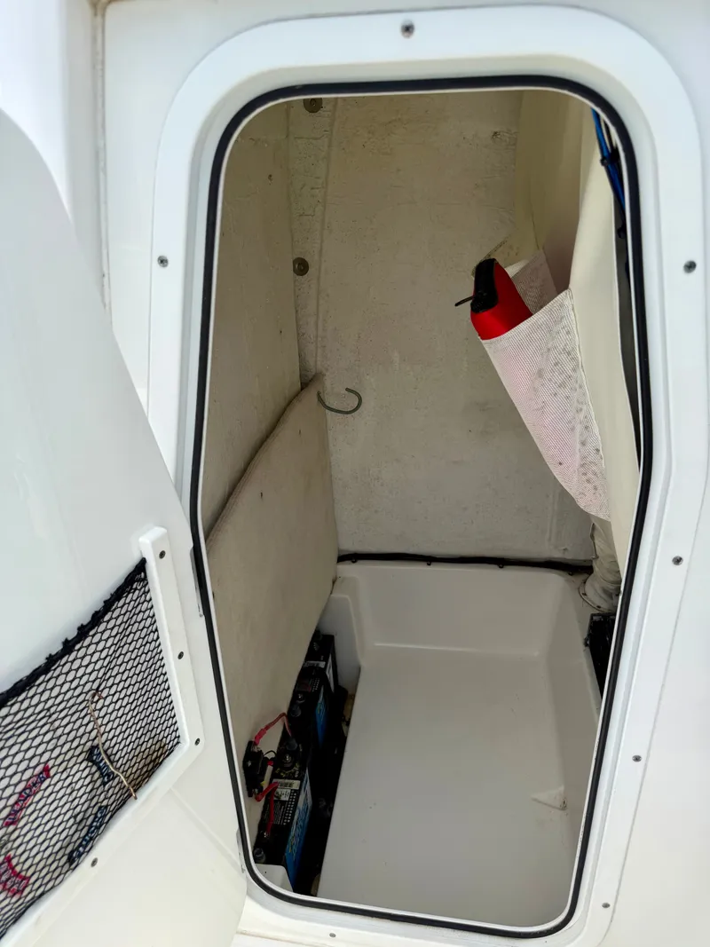 Slide: The Image of Interior of a 2019 Sea Hunt BX 25 FS boat with batteries. - 16