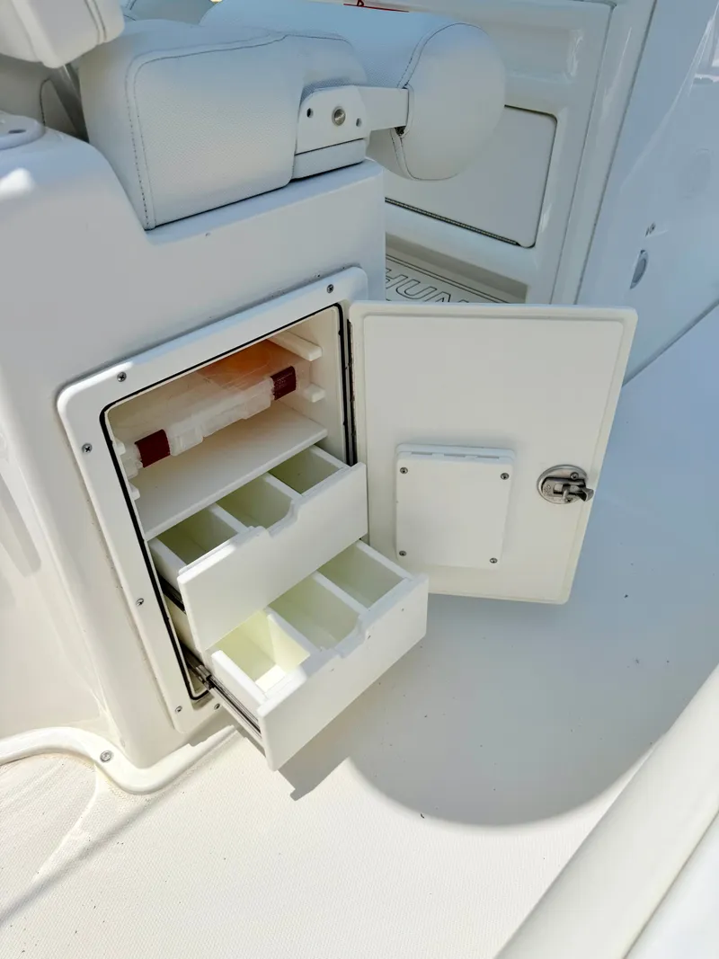 Slide: The Image of 2019 Sea Hunt BX 25 FS boat with open storage compartment. - 20