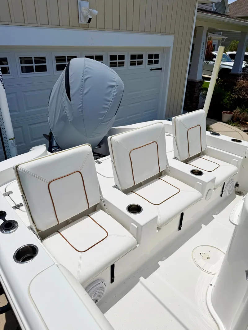 Slide: The Image of 2019 Sea Hunt BX 25 FS boat with white seating. - 25
