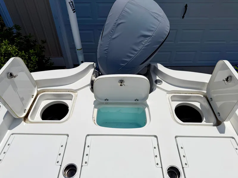 Slide: The Image of 2019 Sea Hunt BX 25 FS boat with open storage compartments. - 26