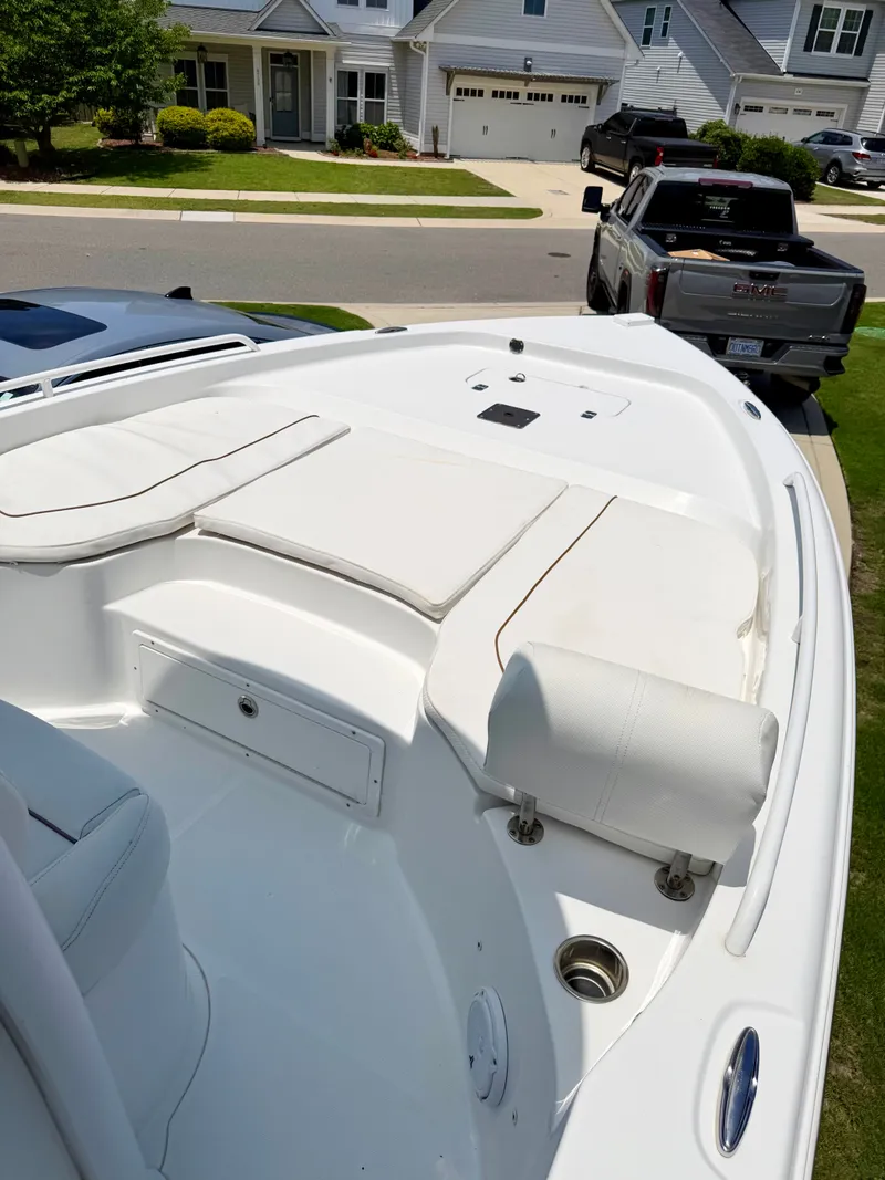 Slide: The Image of 2019 Sea Hunt BX 25 FS boat parked in residential area. - 4