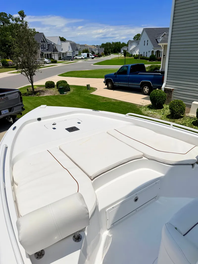 Slide: The Image of 2019 Sea Hunt BX 25 FS boat parked in residential area. - 5