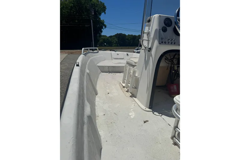 Slide: The Image of 2005 Sea Chaser 175 RG boat interior, featuring steering console and seating area. - 4