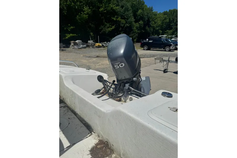 Slide: The Image of 2005 Sea Chaser 175 RG boat with Yamaha 50 outboard motor in a parking area. - 5