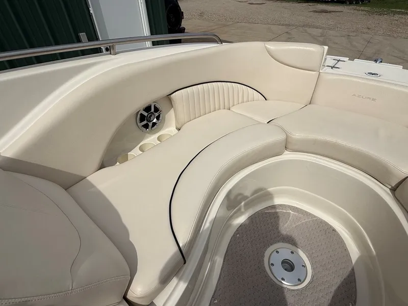 Slide: The Image of Interior of a 2006 Azure AZ240 boat with beige seating. - 10