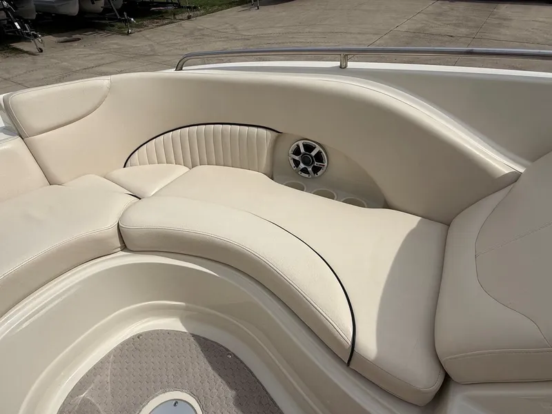 Slide: The Image of Interior of a 2006 Azure AZ240 boat with beige seating. - 11