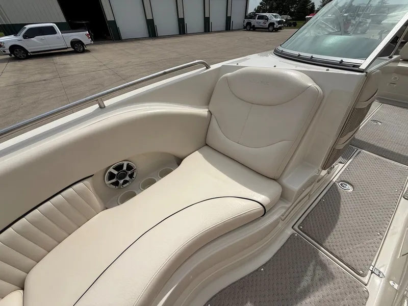 Slide: The Image of Interior of a 2006 Azure AZ240 boat with beige seating. - 12