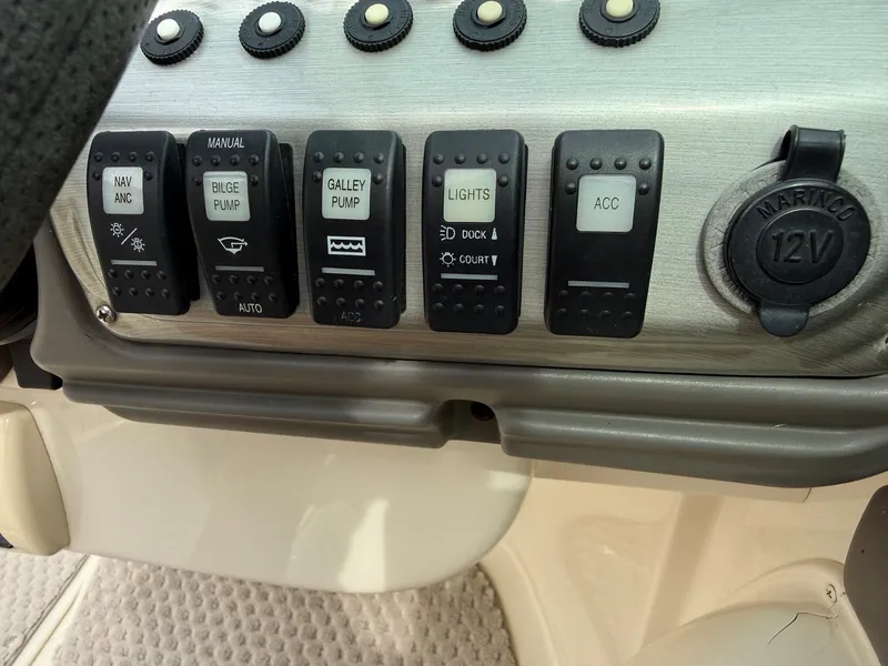 Slide: The Image of Control panel of a 2006 Azure AZ240 boat. - 17