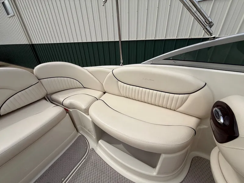 Slide: The Image of Interior of a 2006 Azure AZ240 boat with beige seating. - 22