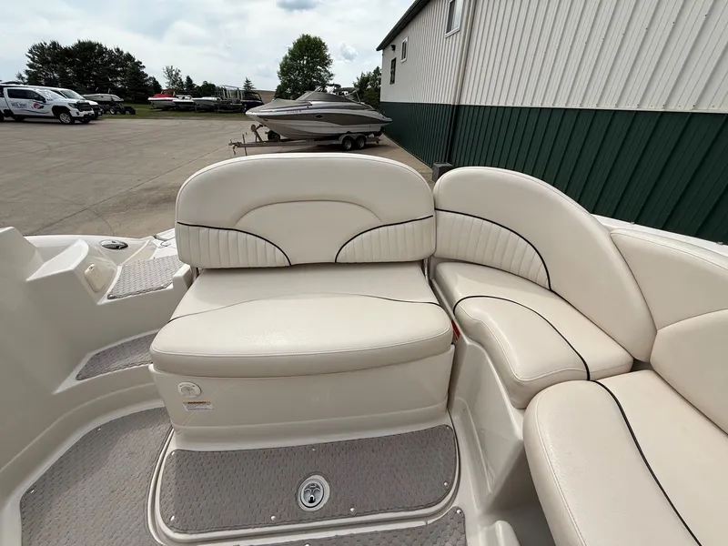 Slide: The Image of Interior of a 2006 Azure AZ240 boat with beige seating. - 23