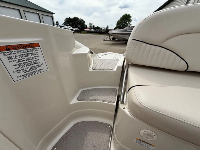 Slide: The Image of Interior of a 2006 Azure AZ240 boat with warning label. - 24