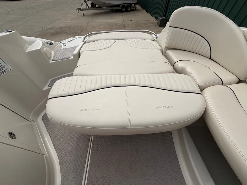 Slide: The Image of Interior of a 2006 Azure AZ240 boat with beige leather seating. - 27