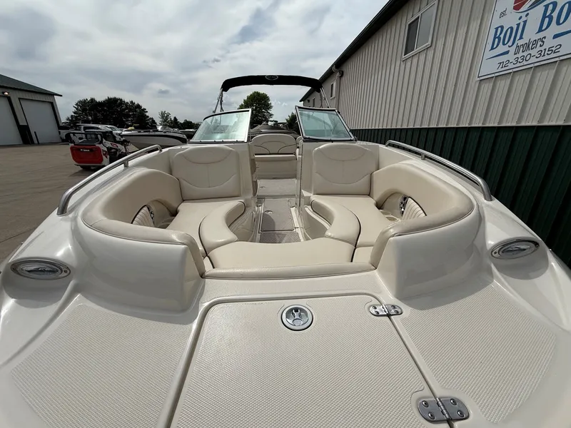 Slide: The Image of Interior view of a 2006 Azure AZ240 boat with beige seating. - 3