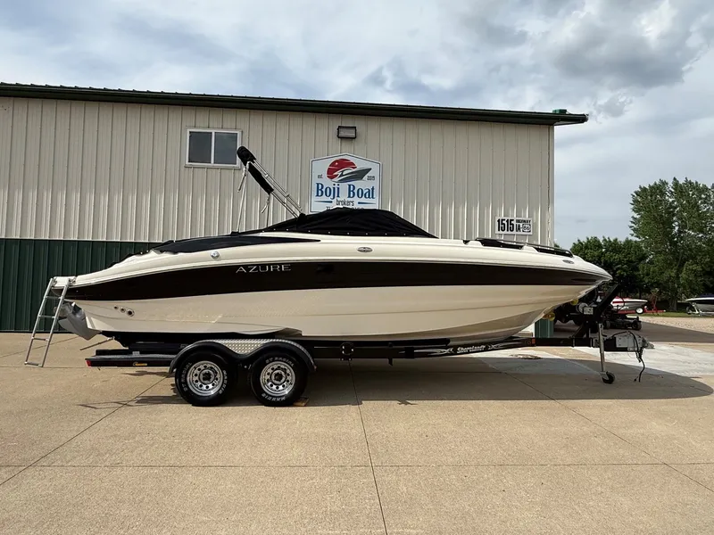 Slide: The Image of 2006 Azure AZ240 boat on trailer in front of Boji Boat building. - 33