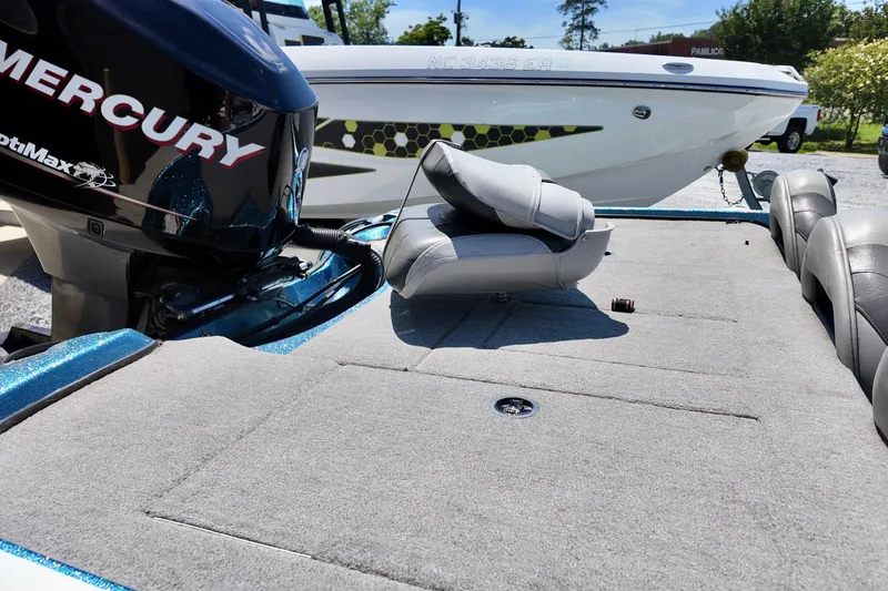 Slide: The Image of 2010 Nitro Z-7 boat with Mercury engine, featuring spacious deck and seating. - 5