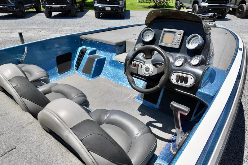 Slide: The Image of Interior of a 2010 Nitro Z-7 boat with steering wheel and dashboard controls. - 6