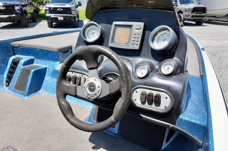 Slide: The Image of Dashboard of a 2010 Nitro Z-7 boat with steering wheel and gauges. - 7