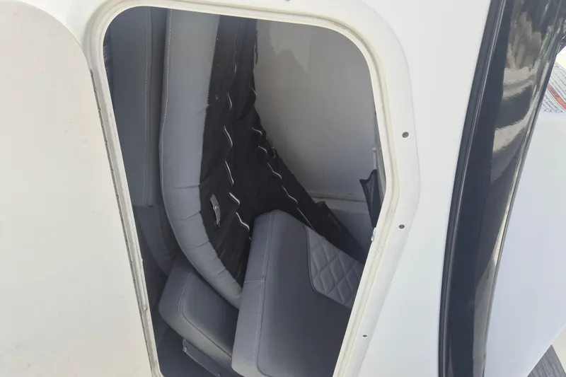 Slide: The Image of Interior storage compartment of 2024 NauticStar 251 Hybrid boat. - 26