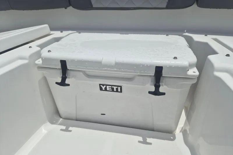 Slide: The Image of 2024 NauticStar 251 Hybrid boat with Yeti cooler on deck. - 31