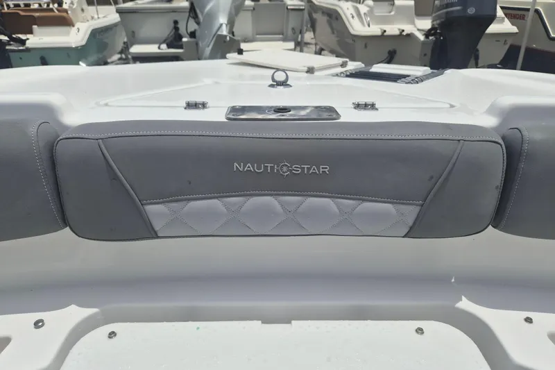 Slide: The Image of 2024 NauticStar 251 Hybrid boat seat with logo, showcasing luxury marine design. - 32