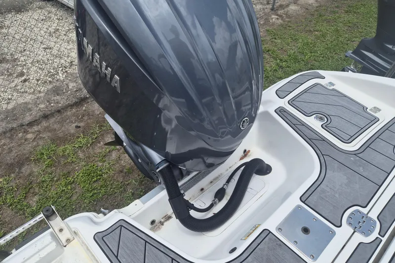 Slide: The Image of 2024 NauticStar 251 Hybrid boat with Yamaha outboard motor, featuring sleek deck design. - 39