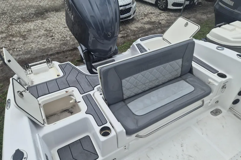Slide: The Image of 2024 NauticStar 251 Hybrid boat interior with seating and storage compartments. - 8