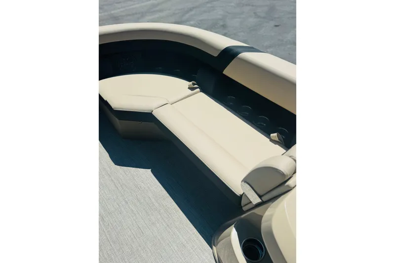 Slide: The Image of Luxurious seating on the 2026 Berkshire 24 RFX CTS pontoon boat, featuring beige upholstery. - 14