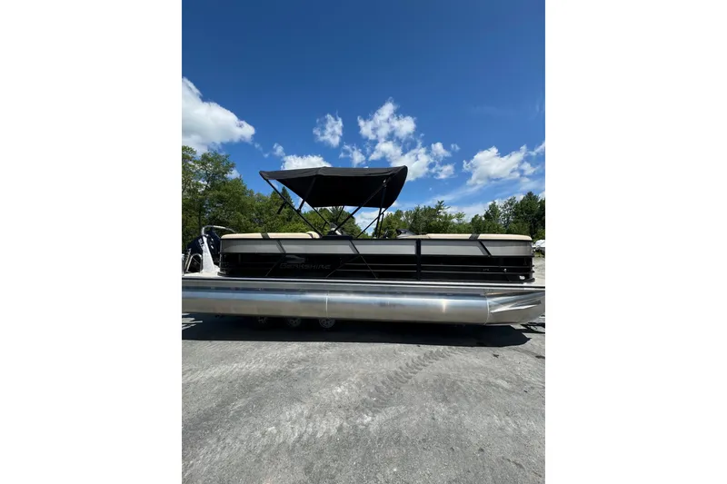 Slide: The Image of 2026 Berkshire 24 RFX CTS pontoon boat with canopy on a sunny day. - 5