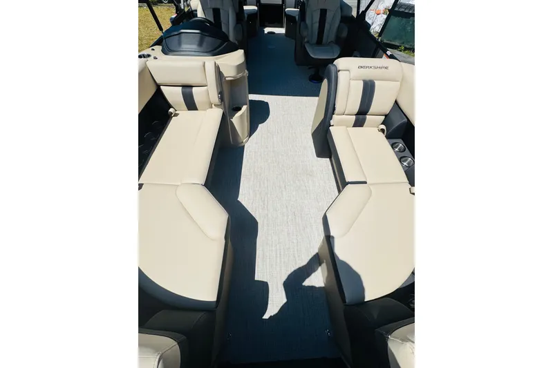 Slide: The Image of Interior view of 2026 Berkshire 24 RFX CTS pontoon boat with beige seating. - 8