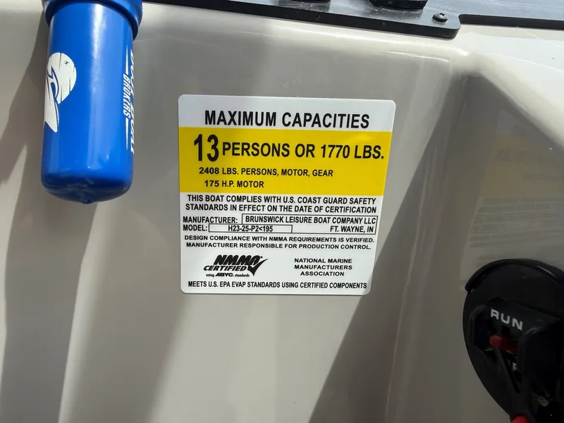 Slide: The Image of Harris Sunliner 230 boat capacity label, 13 persons or 1770 lbs. - 15