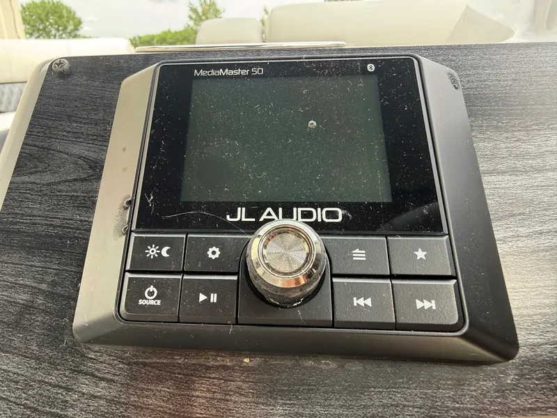 Slide: The Image of JL Audio MediaMaster 50 control on Harris Sunliner 230, 2021. - 16