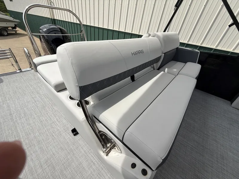 Slide: The Image of Harris Sunliner 230 boat, 2021, featuring luxurious white seating. - 21