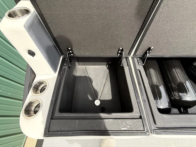Slide: The Image of Harris Sunliner 230 2021 storage compartment with cup holders. - 26